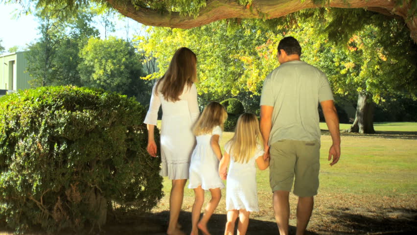 Young caucasian family enjoying time out together  on a summers day