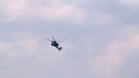 ZHUKOVSKY, MOSCOW REGION, RUSSIA - AUG 12, 2012: Flying Mi-28N helicopter (Berkuts aerobatic team) on air show devoted to 100 anniversary of Russian Air Forces.
