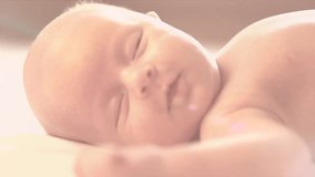 Newborn baby waking up and opening eyes. Close-up. Sleeping Infant. Slow motion Video Footage 240 fps