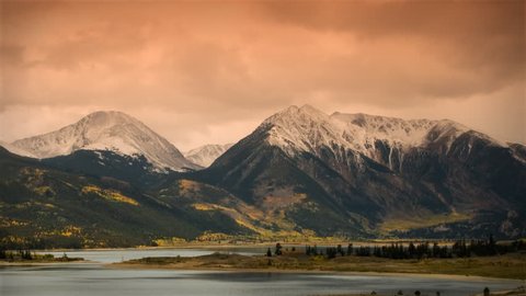 (1118) Autumn Early Snow Storm - Sunrise Timelapse of Mountains and Aspen. Great for themes of nature, travel, wilderness, seasons, weather, mountains, exploration, outdoor recreation, adventure. Stock Video