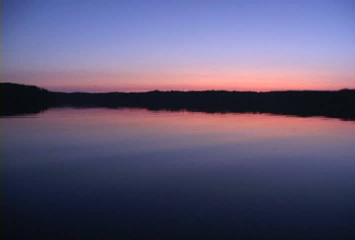 Beautiful reflection at lake in Minnesota during sunset.