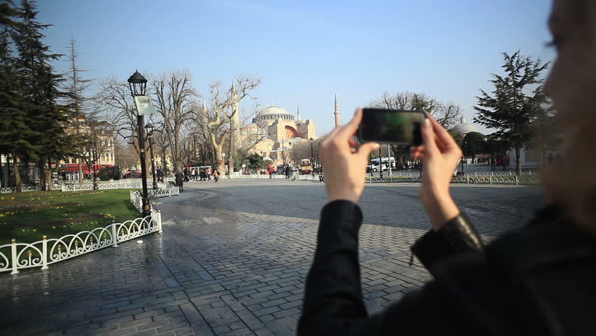Tourist Woman Takes Pictures of Hagia Sophia, Istanbul. 