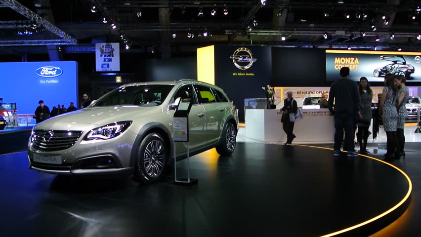 Opel Insignia Country Tourer Station Wagon On Display At The 14 Brussels Motor Show A Group Of People Is Discussing The Cars On The Right