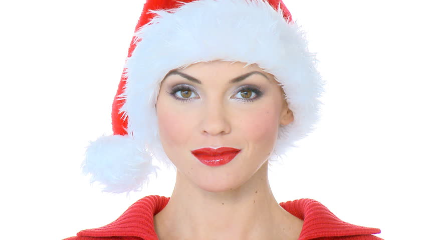 Beautiful sexy girl sending kiss, she is wearing santa claus hat 