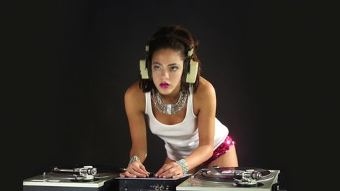 a sexy female dj dancing and playing records. this is a super high quality 4k version at 4096x2304 pixels