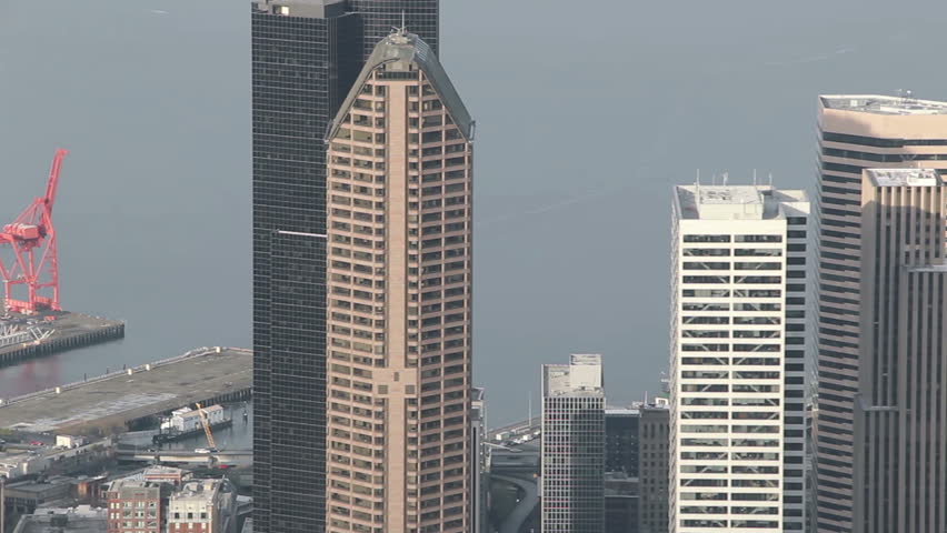 Aerial perspective panning across urban downtown skyscrapers in Seattle, USA