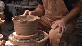 Detailed Molding Clay sculpted potter artist sculpting pots on spinning wheel HD High Definition Stock Video Footage 1080 1920x1080 