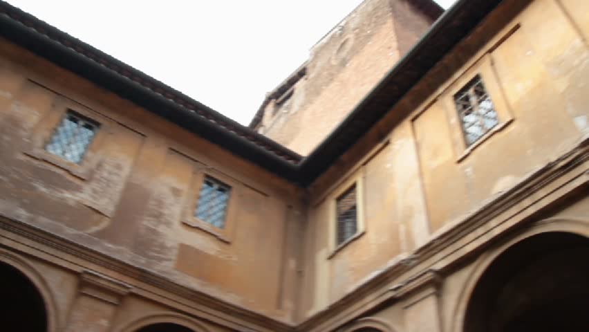 Santi Quattro Coronati ancient basilica courtyard in Rome, Italy.