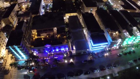 Aerial footage of Ocean Drive in Miami Beach Florida at night