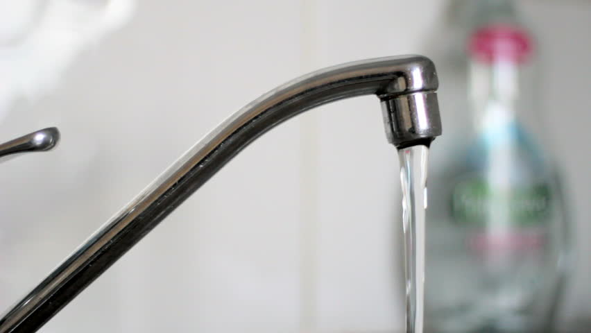 Water Flowing from the Tap. : стоковые 