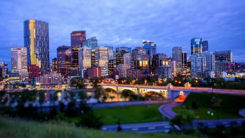 Night shot of downtown Calgary, time lapse, business names are blurred out, Ultra HD, 4K