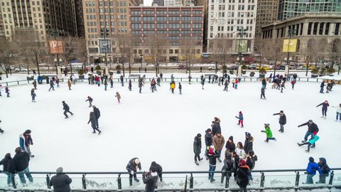 CHICAGO - JANUARY 3: People skating on an outdoor ice rink in downtown Chicago on January 3, 2014