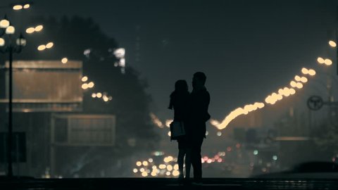 embracing couple in the night,Beijing,China.