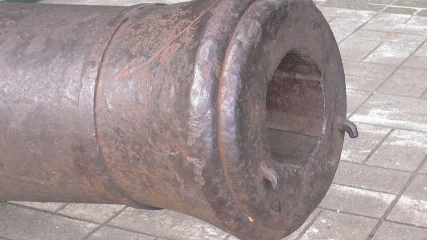 zoom-out clip of huge vintage, century old cannon displayed at fort santiago manila
