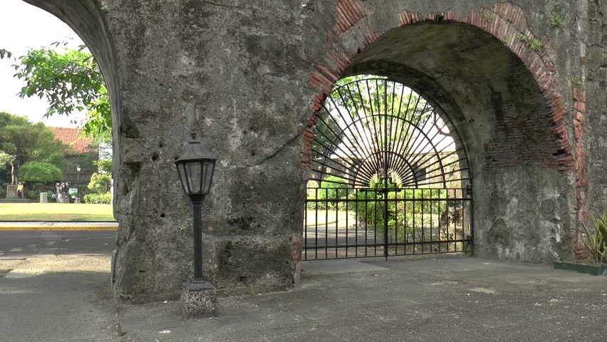 pan shot of vintage gate and thick wall, fort santiago manila philippines
