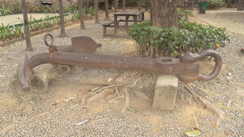 displayed huge vintage rusty anchor static shot on ground.
