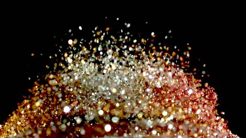 glitter exploding into a rainbow of colors slow motion