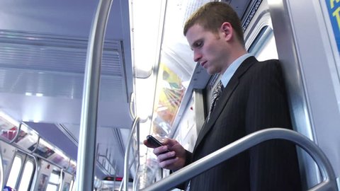 Business Man Using Smartphone on Clean Subway - Close Profile Shot