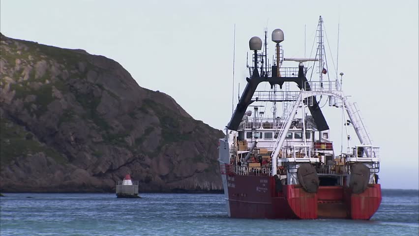 A coast guard vessel exists St. John Harbour (Zoom)