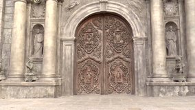 zoom-in shot of carved doors of san agustin church, intramuros, manila philippines. national historical landmark. designated as world heritage site by unesco.
