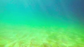 Video 1920x1080 - Man under water over a sandy bottom of the sea