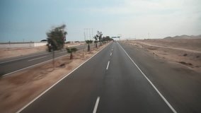 video footage of a car trip on the panamericana near by Ica in Peru POV