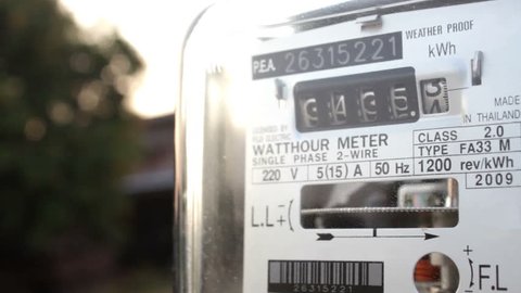 Electric power supply meter at sunset, closeup