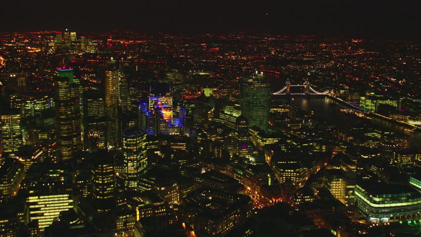 Aerial shot of Central London at night with view of Waterloo Station, St Paul's Cathedral, River Thames & OXO Tower