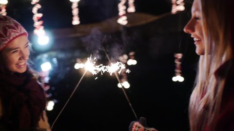 Teen Laughing Girls With Sparklers During The Winter Holidays Stock Video