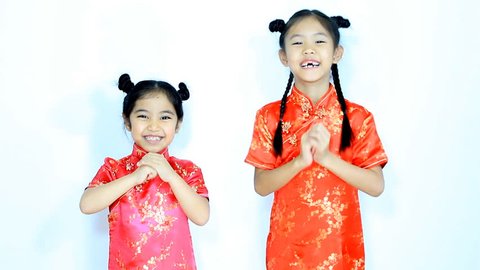 Happy little Asian Chinese children in traditional dress