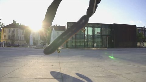 Skateboarder does flip at sunset