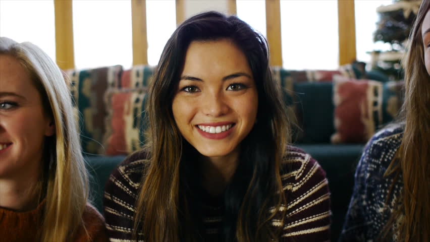 Asian Teen Girl Framed In A Candy Cane Heart Blows A Kiss