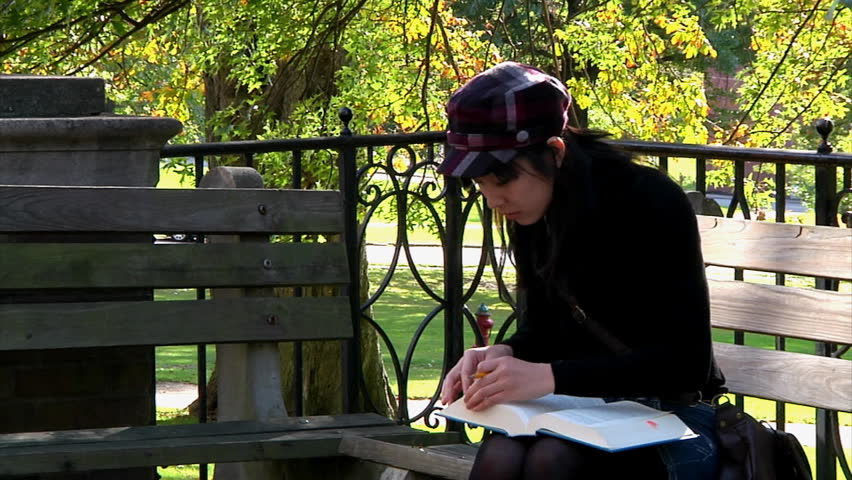 A student studies on campus.