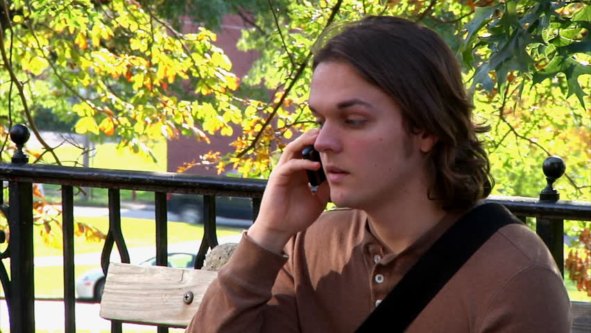 A student talks on his cellular phone on campus.