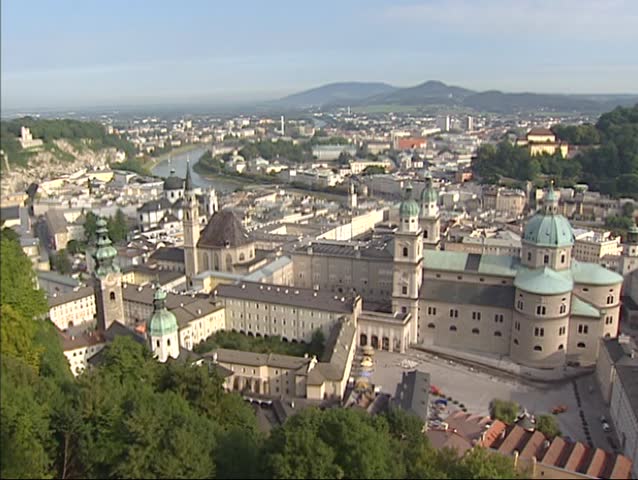 SALZBURG, AUSTRIA - AUGUST 2001: high angle view at historic city center altstadt, St. Peters Abbey, cathedral Salzburger Dom and river Salzach.