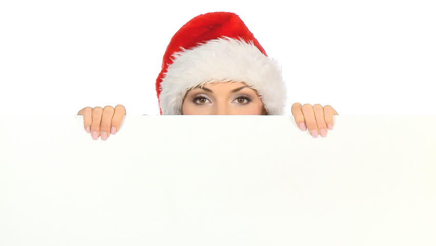 Girl in santa claus hat holding empty board 