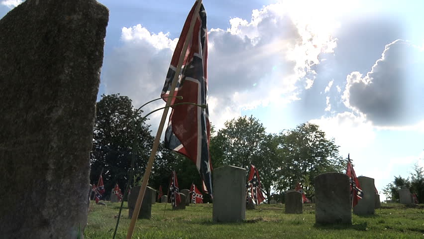 Confederate graves decorated with small Confederate battle flags.
