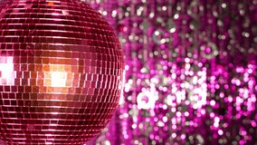 funky pink mirror ball spinning with patterns of light. useful for vj loops, events, clubs and parties
 - Powered by Shutterstock - Get 15% off with code: PIKWIZARD15