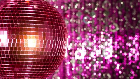 funky pink mirror ball spinning with patterns of light. useful for vj loops, events, clubs and parties
