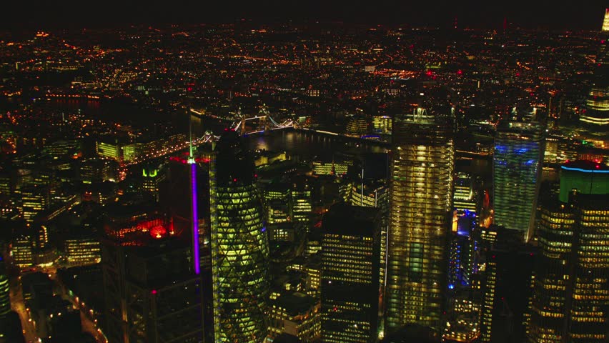 Aerial shot of Central London at night with a view of the Shard, River Thames, The Gherkin & Tower Bridge Royalty-Free Stock Footage #5502185