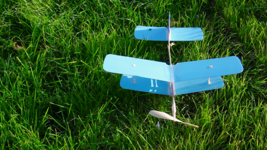 toy aircraft on green grass 