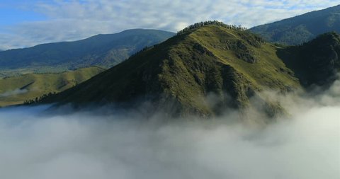Flight over the Mountains. Altai. Siberia. Flying over the River. Forest Valley. Morning Fog