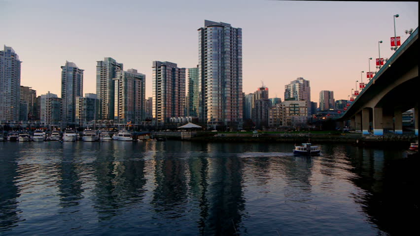 Pan across Vancouver skyline at sunset