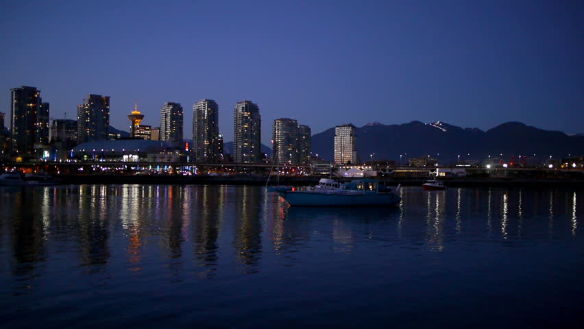 Pan across Vancouver skyline at night