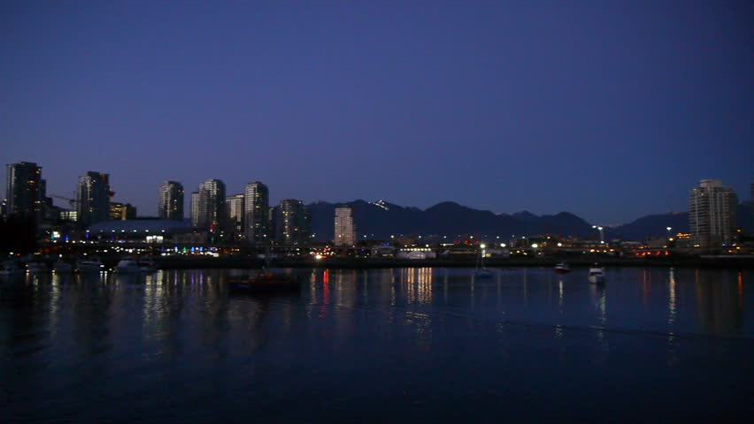 Pan across Vancouver skyline at night