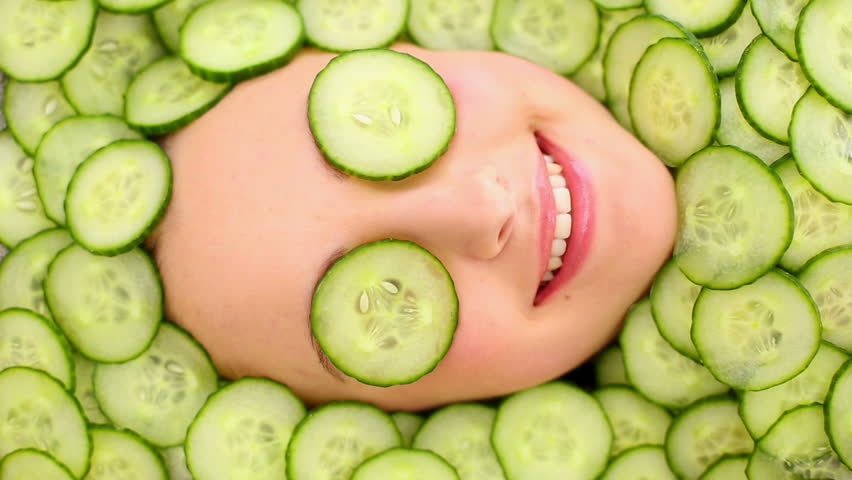 smiling womans face surrounded by cucumber Stock Footage Video (100% Royalty-free) 5519327 | Shutterstock