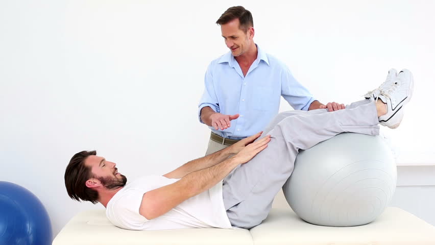 Physical Therapist Helping His Patient Stock Footage Video (100%  Royalty-free) 5520731 | Shutterstock