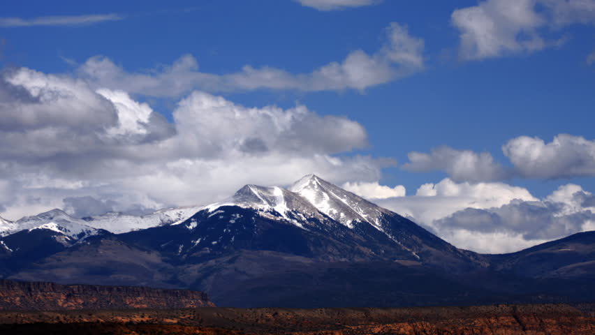 Time lapse of clouds rolling over the snowy peaks of the LaSal Mountains.