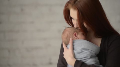 Little baby in mother arms. FullHD, 1080p.