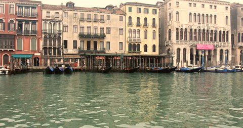 Canals, Venetian boats and old architecture in Venice.